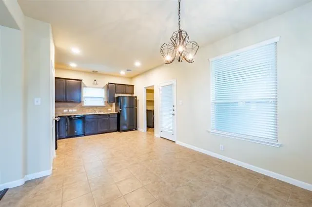 a large kitchen with a chandelier