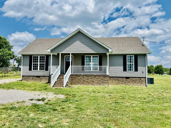 front view of a house with a yard