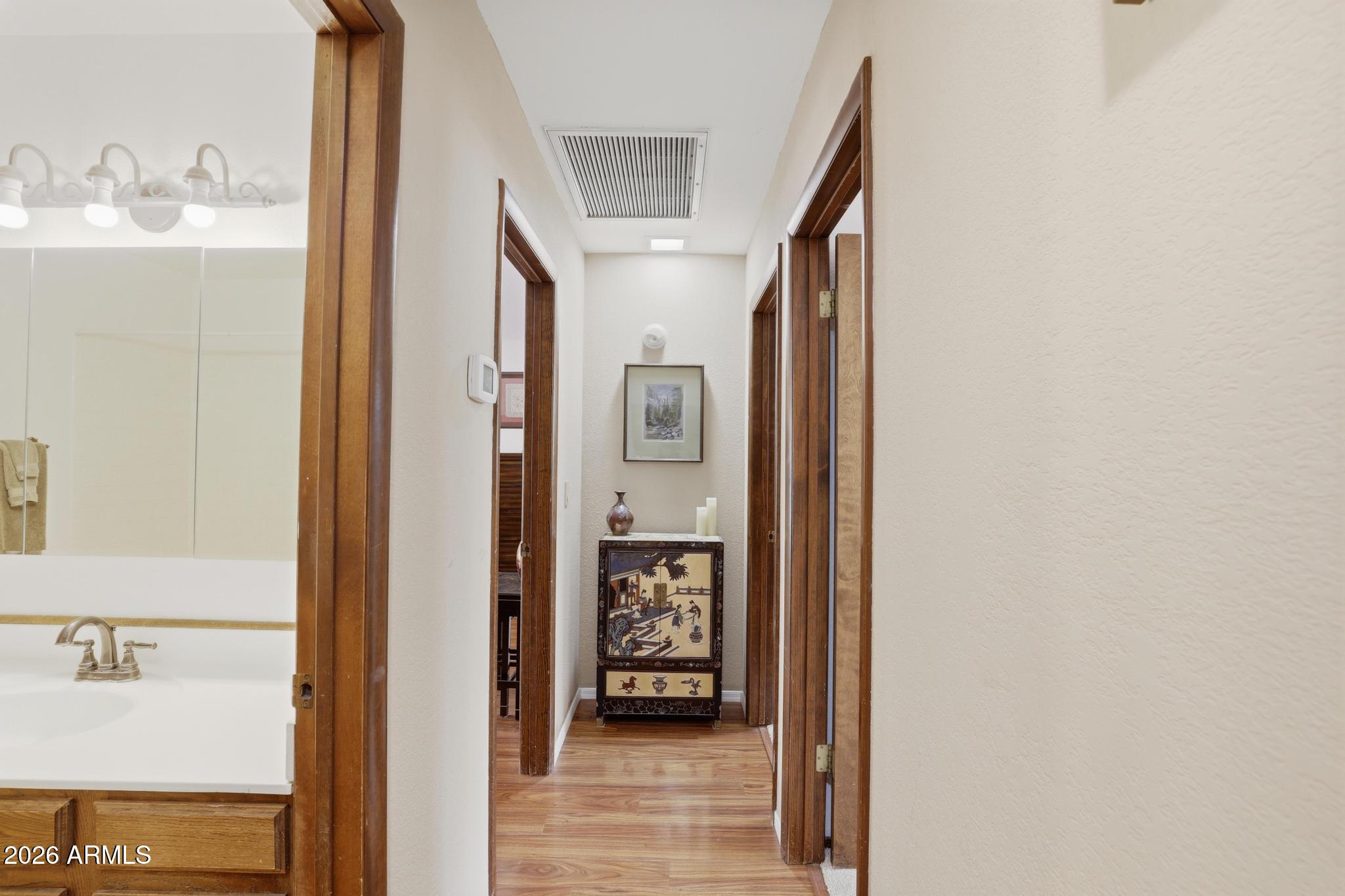 1103 South Pineview Circle Payson, AZ 85541 - Photo 23 of 42 a view of a hallway view with wooden floor and living space with furniture