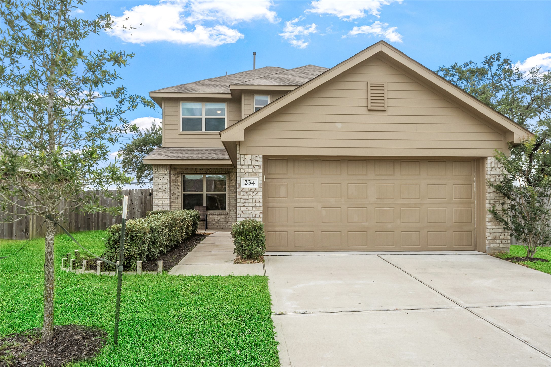 234 Bennett Street Angleton, TX 77515 - Photo 1 of 33 This charming two-story house features a neutral-toned exterior with a combination of siding and brick.