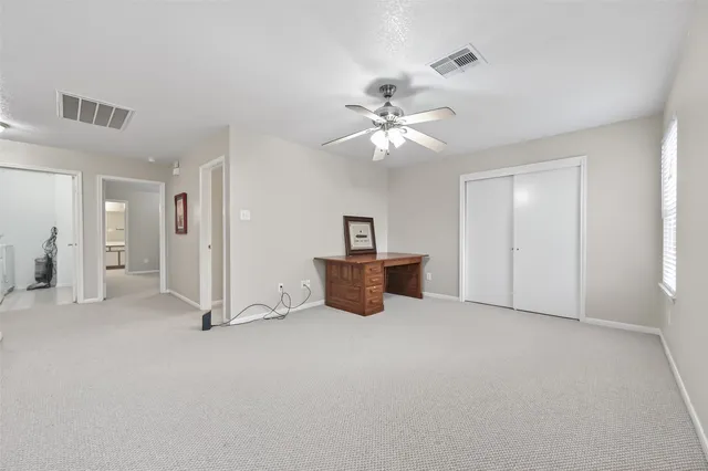 a view of an empty room with a cabinet