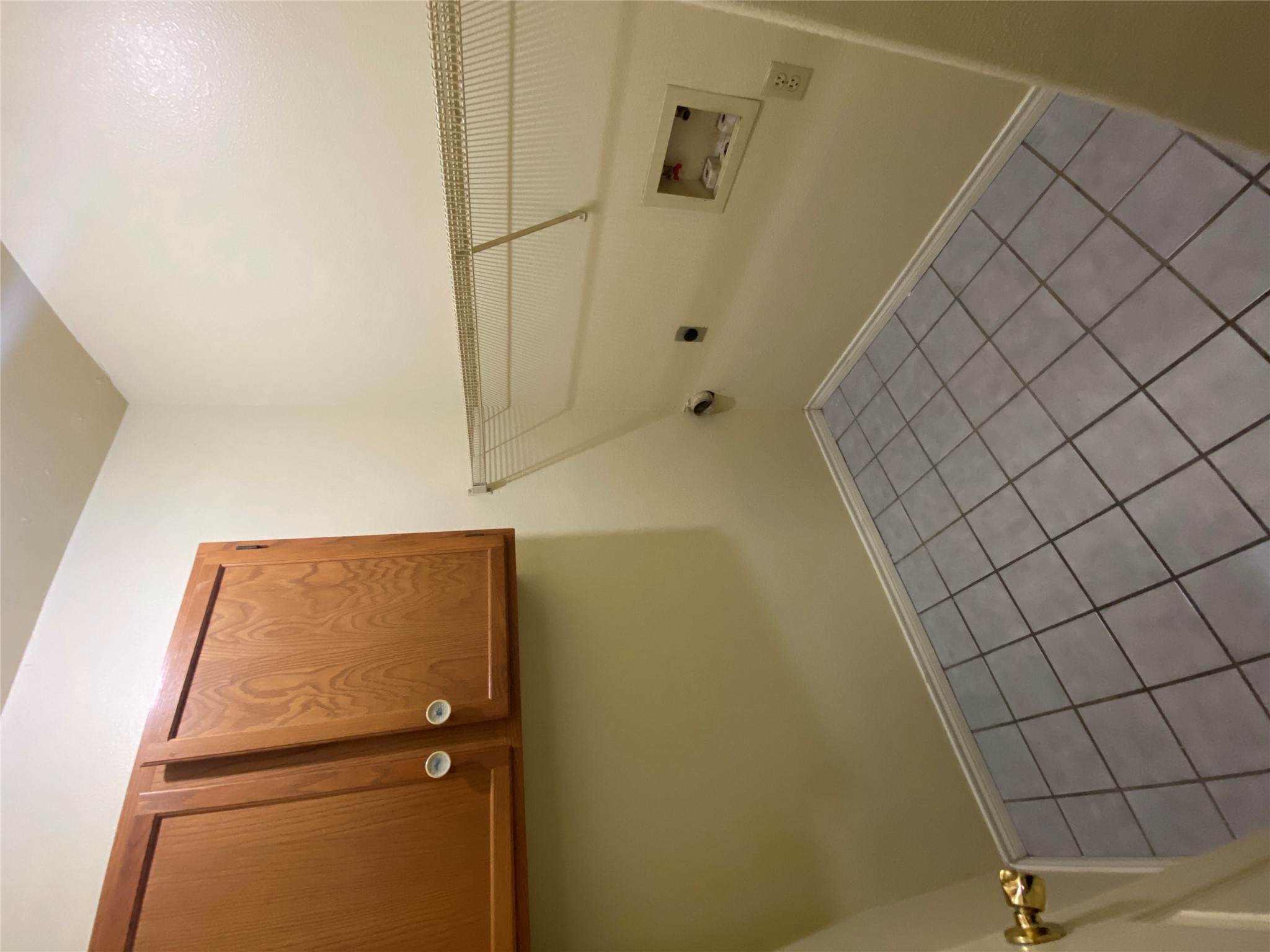 2605 Alcott Lane, Unit B Austin, TX 78748 - Photo 6 of 15 Functional laundry space featuring ample overhead storage and durable tile flooring.