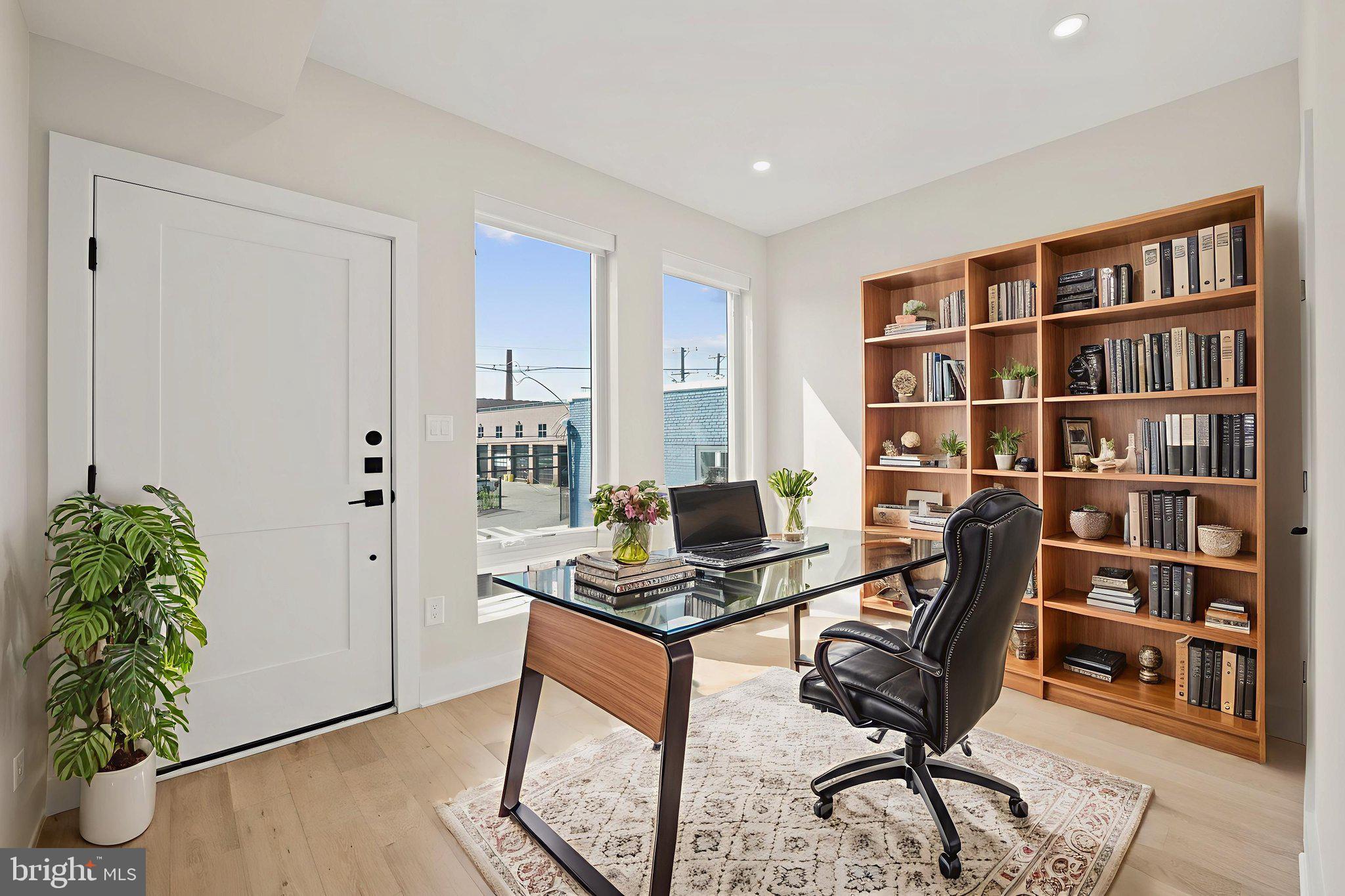 1923 Capitol Avenue Northeast, Unit 2 Washington, DC 20002 - Photo 15 of 32 a view of a workspace with furniture and bookshelf