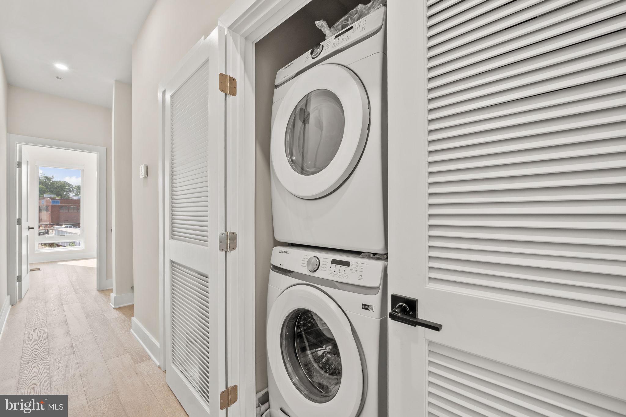 1923 Capitol Avenue Northeast, Unit 2 Washington, DC 20002 - Photo 21 of 32 a view of a hallway with washer and dryer