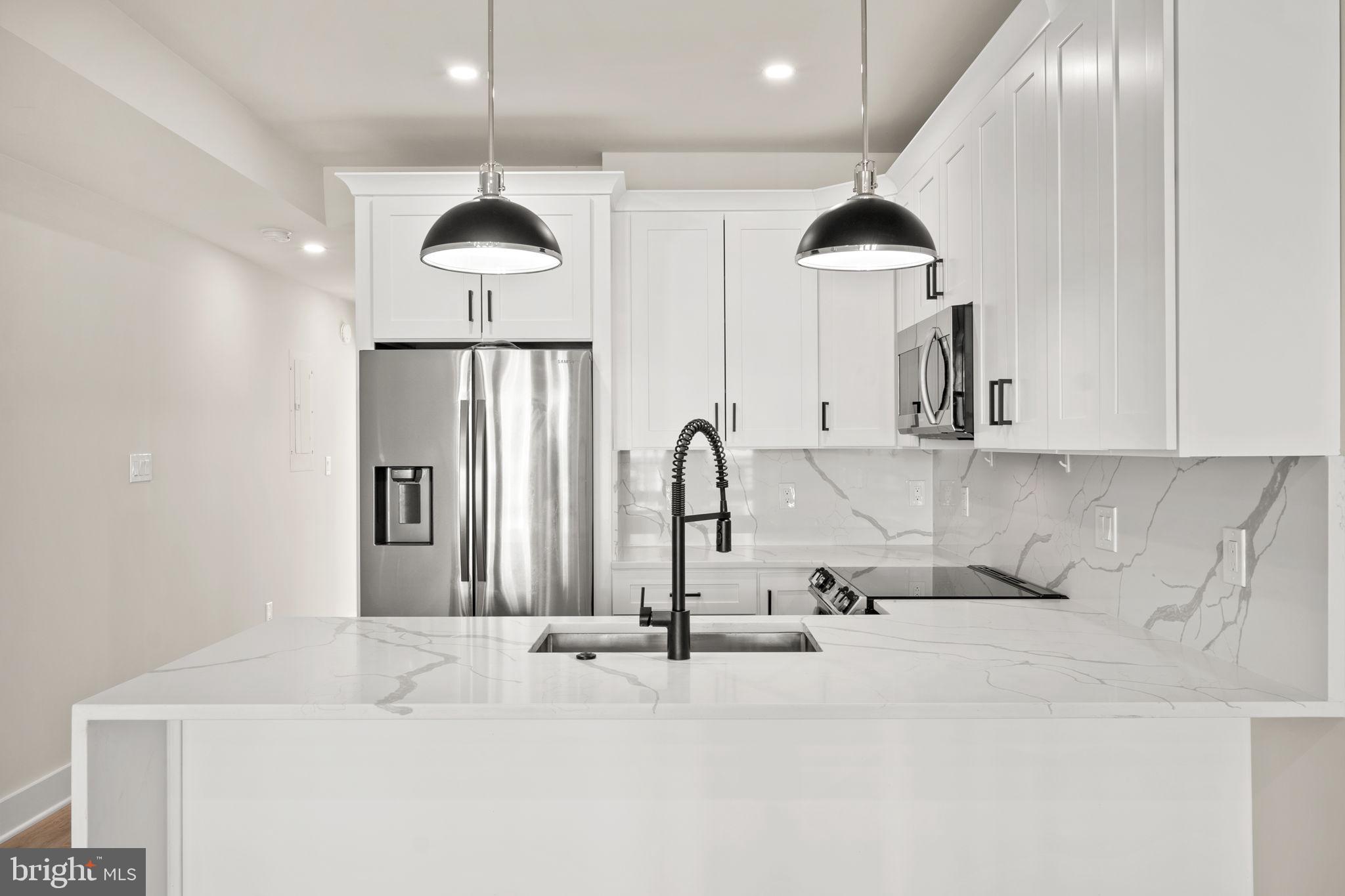 1923 Capitol Avenue Northeast, Unit 2 Washington, DC 20002 - Photo 7 of 32 a bathroom with a sink and a mirror