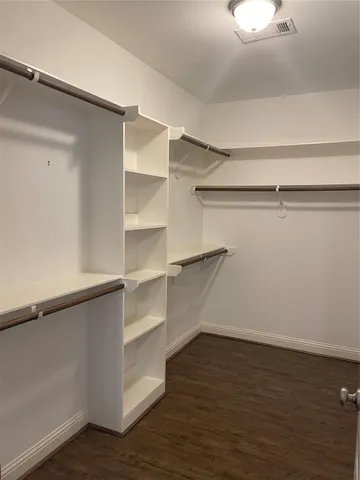 a view of an empty walk in closet