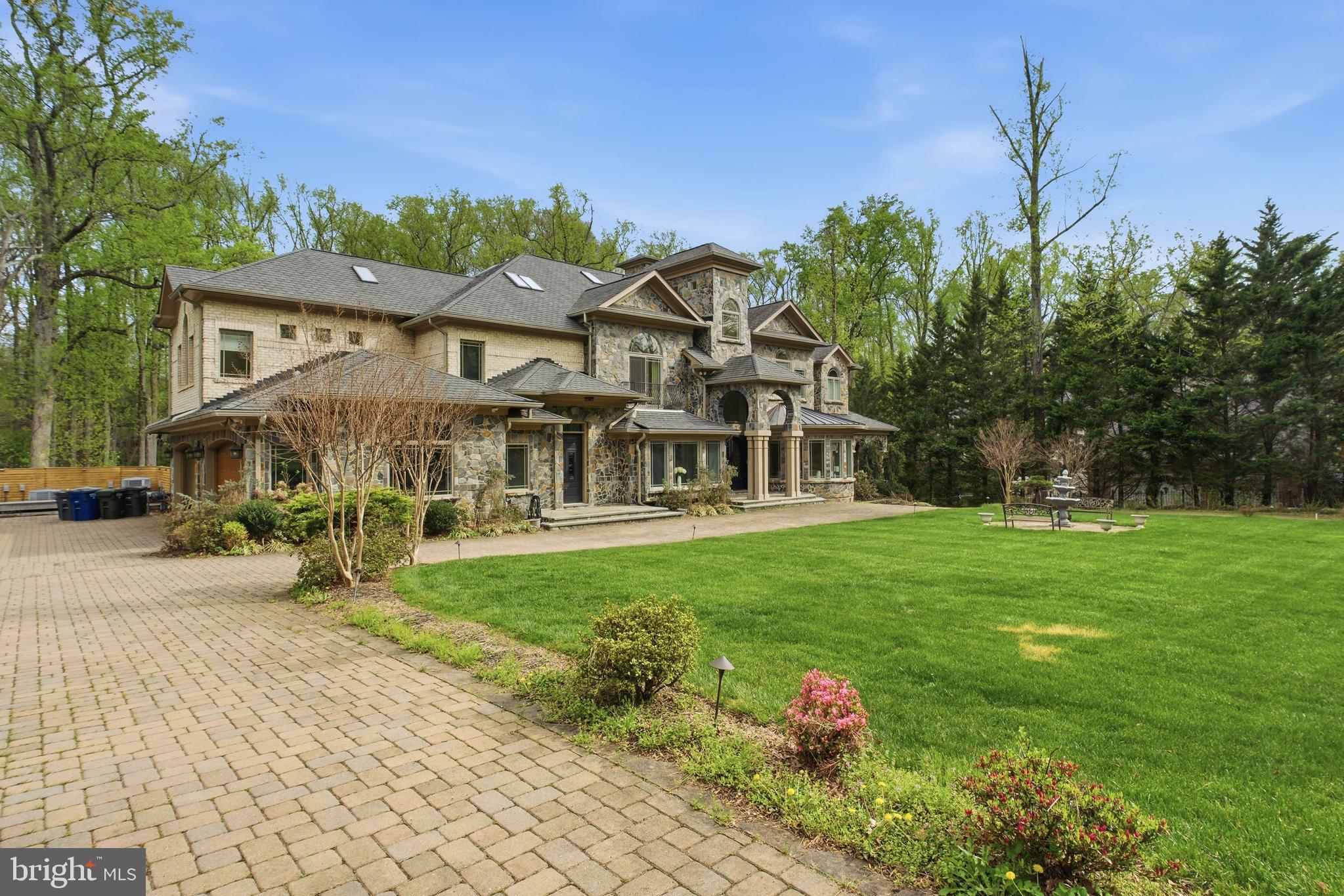 a front view of a house with a yard table and chairs