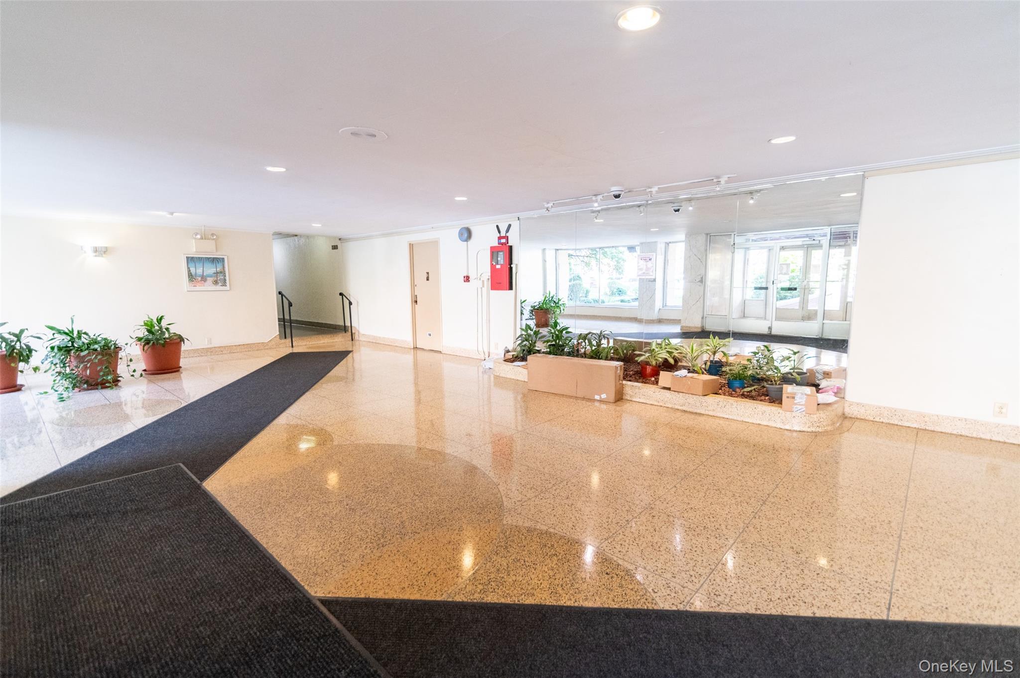 1 Sadore Lane, Unit 5A Yonkers, NY 10710 - Photo 20 of 23 a view of a living room and kitchen
