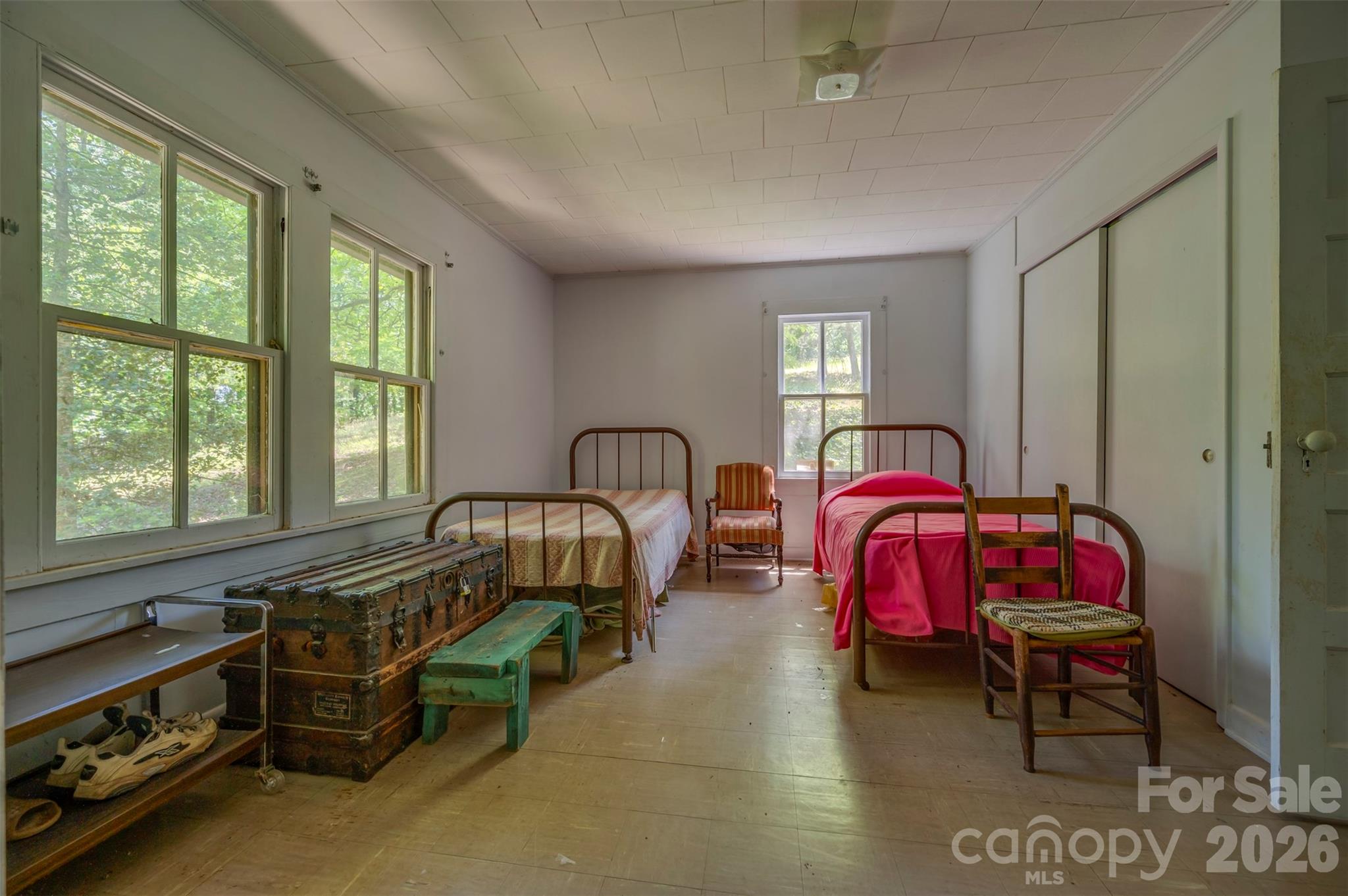 77 1st Street Tryon, NC 28782 - Photo 16 of 20 a bedroom with bed and a window