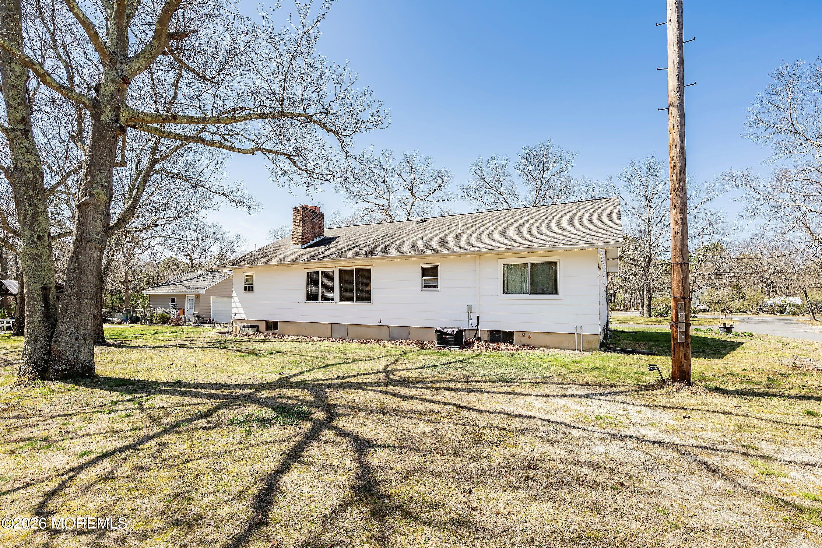 745 Oak Glen Road Howell, NJ 07731 - Photo 32 of 46 a front view of a house with a yard