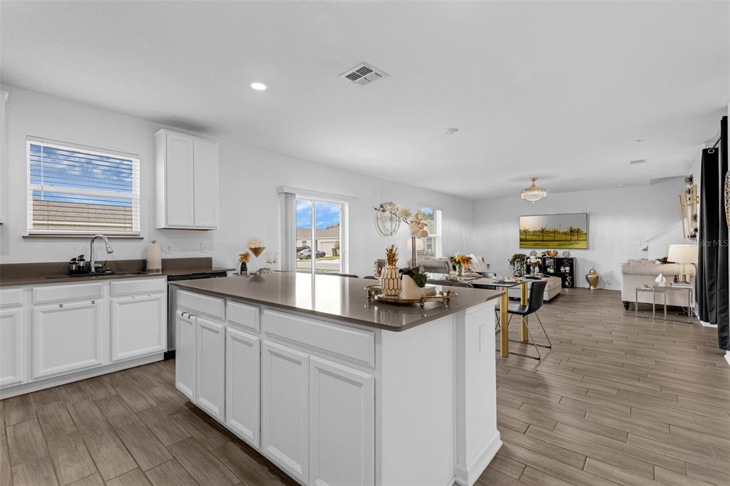 34535 Shellback Street Leesburg, FL 34788 - Photo 13 of 36 a kitchen with sink and cabinets