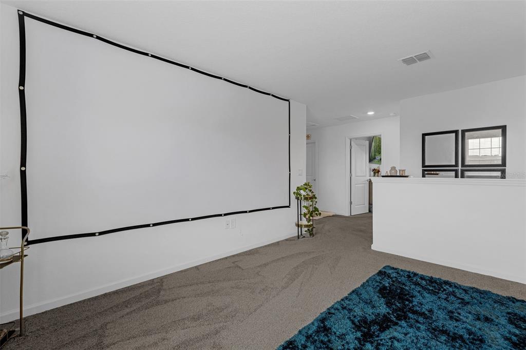 34535 Shellback Street Leesburg, FL 34788 - Photo 20 of 36 a view of a refrigerator in kitchen and wooden floor