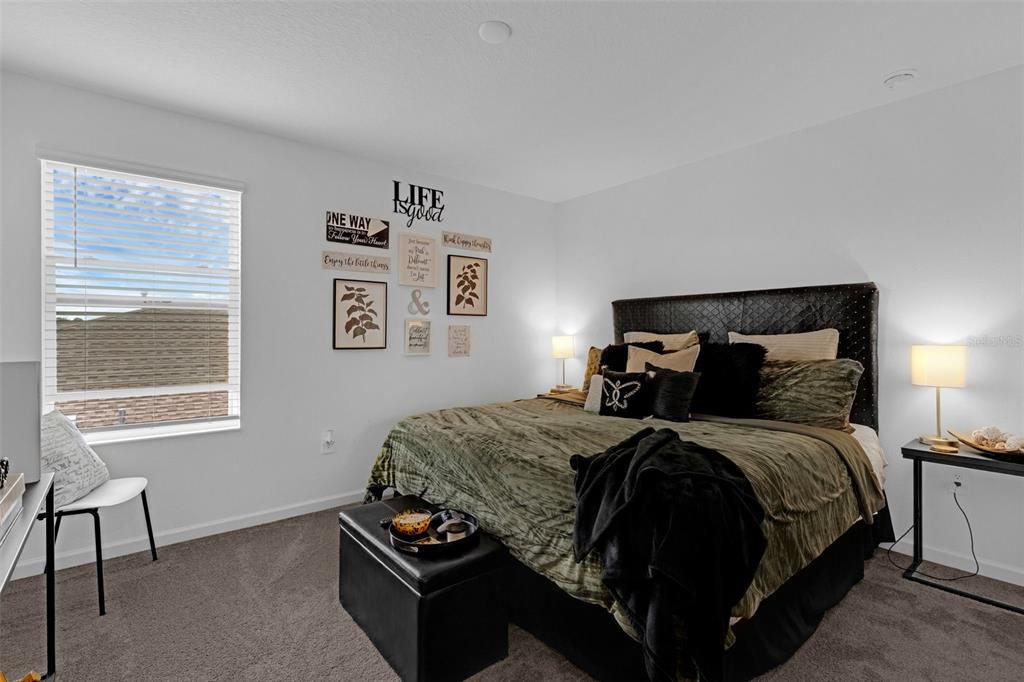 34535 Shellback Street Leesburg, FL 34788 - Photo 24 of 36 a bedroom with a bed and window