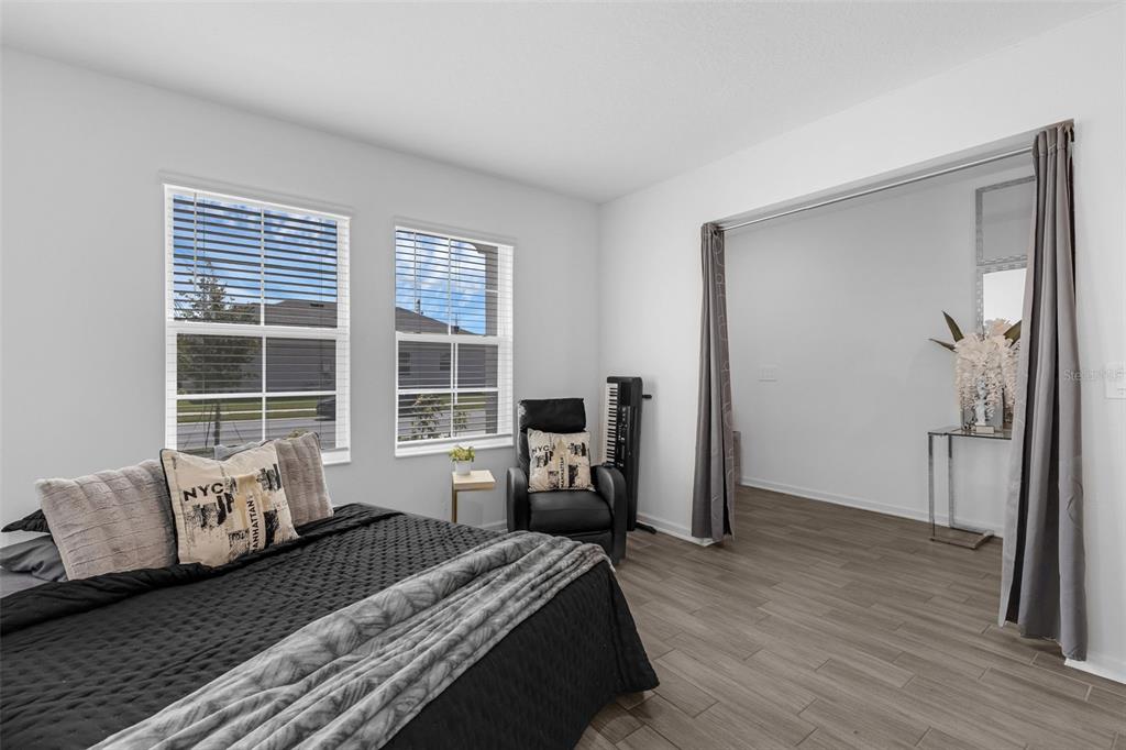 34535 Shellback Street Leesburg, FL 34788 - Photo 30 of 36 a bed room with a bed and a window