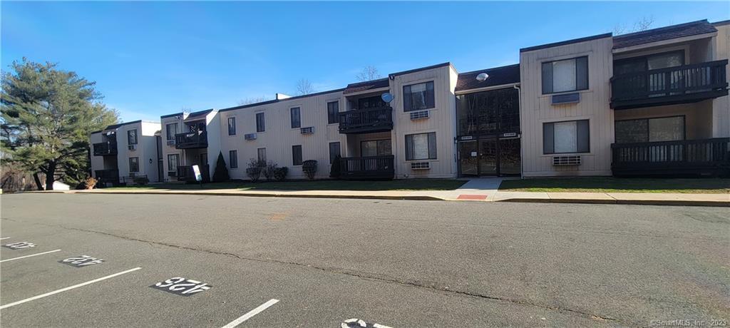 175 Mill Pond Road, Unit 436 Hamden, CT 06514 - Photo 1 of 1 a view of a building with a road
