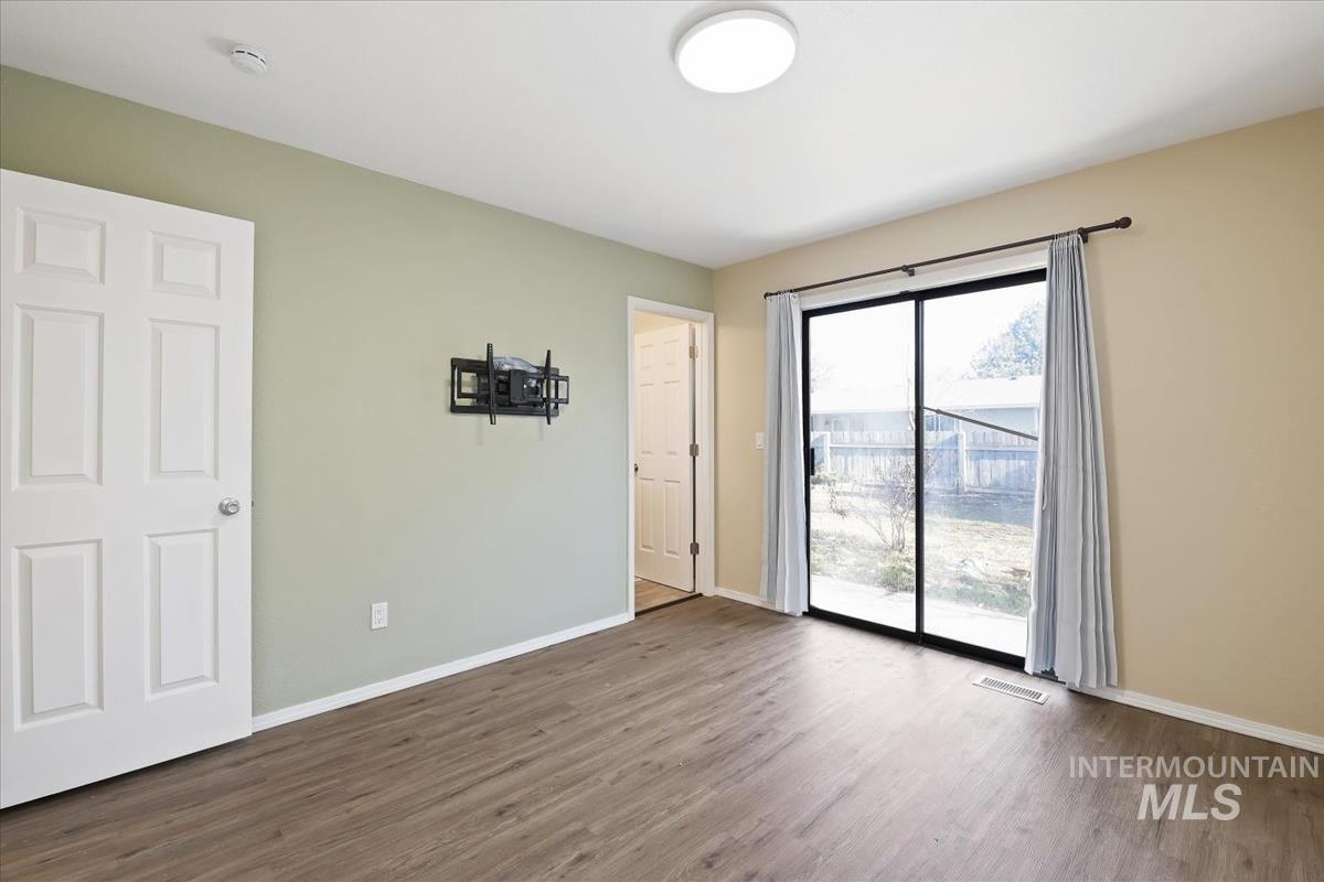7091 West Limelight Street Boise, ID 83714 - Photo 19 of 34 Master bedroom with baseboards and wood finished floors