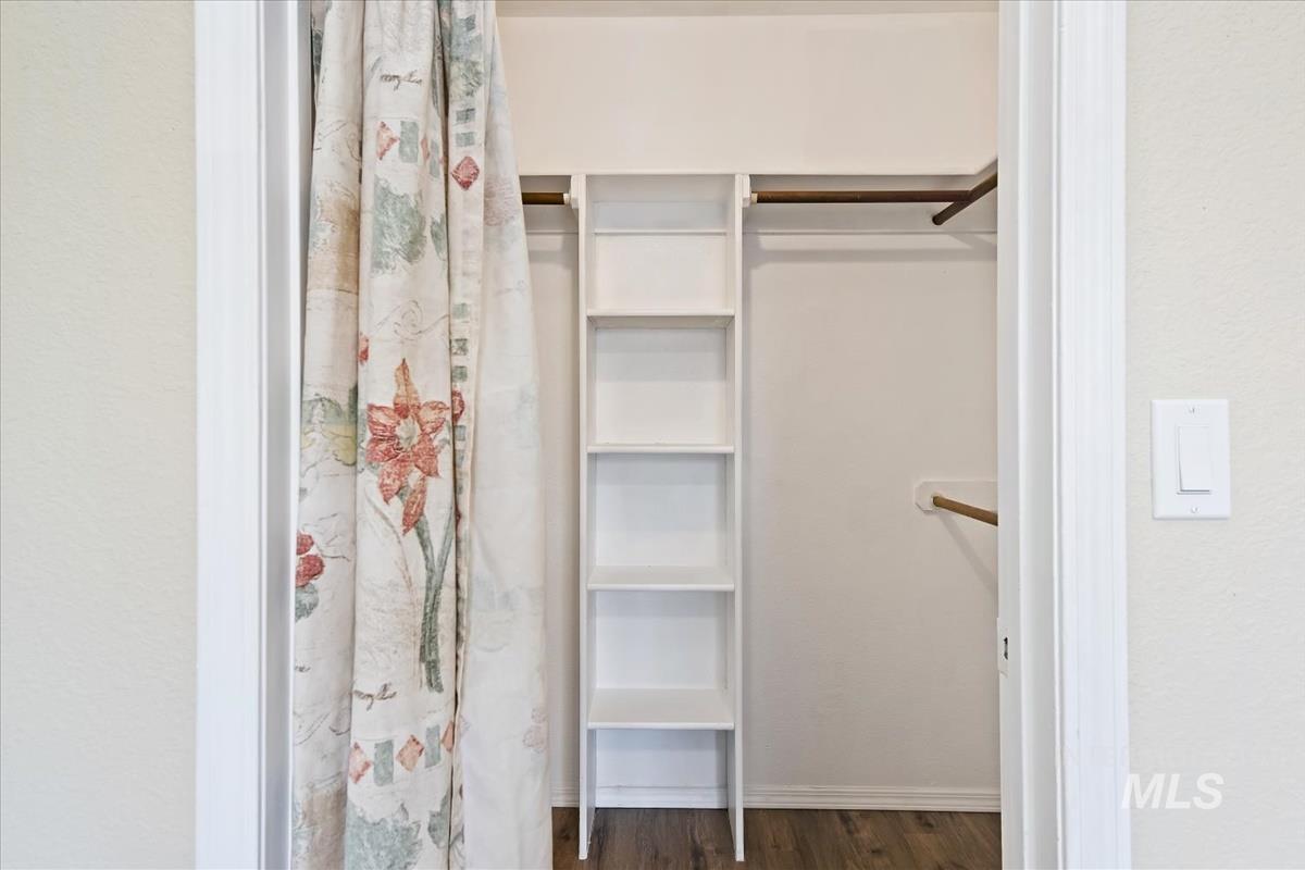 7091 West Limelight Street Boise, ID 83714 - Photo 24 of 34 Walk in closet with dark wood-style flooring