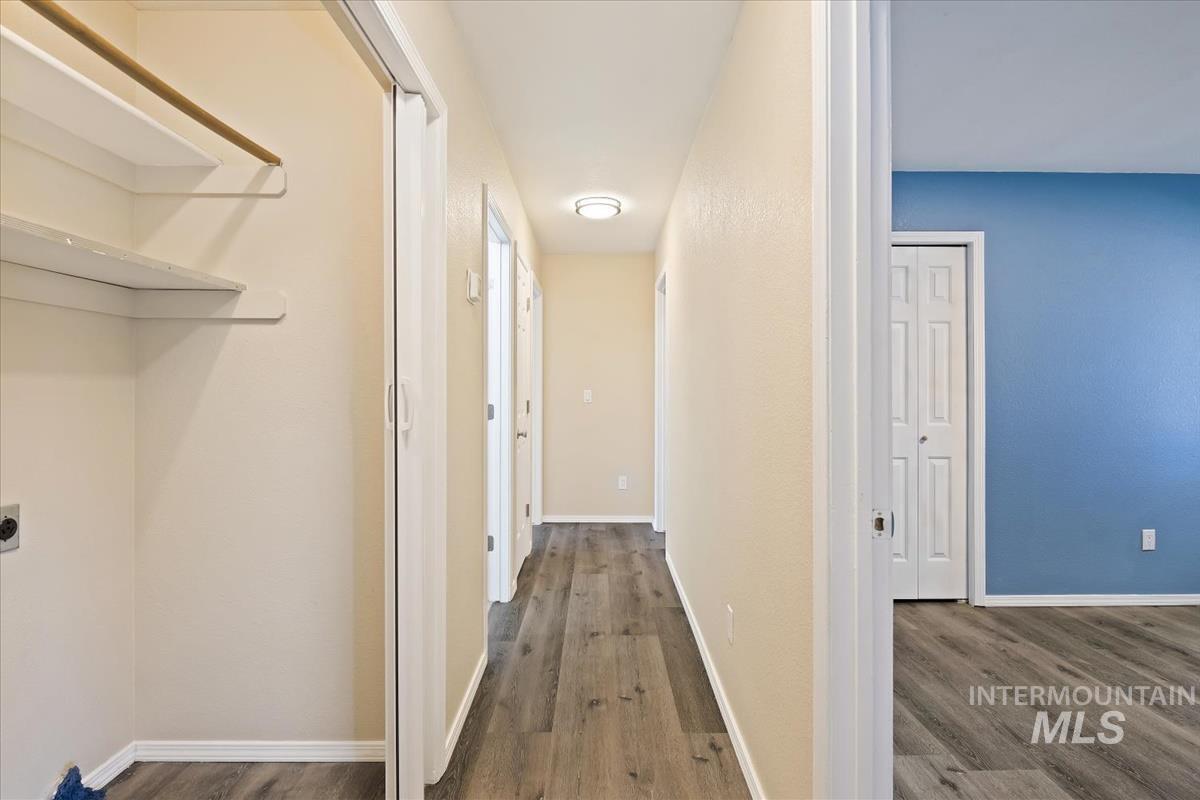 7091 West Limelight Street Boise, ID 83714 - Photo 25 of 34 Hallway with dark wood-type flooring and baseboards