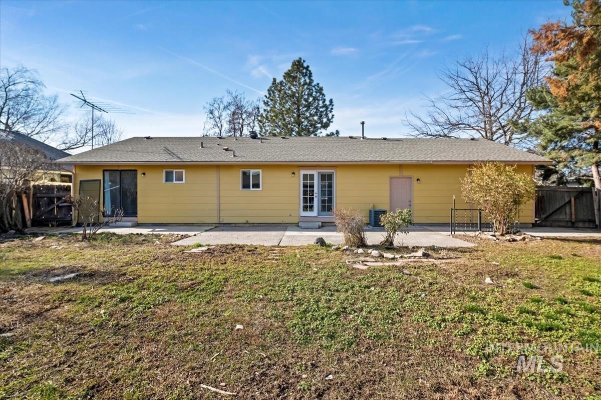 7091 West Limelight Street Boise, ID 83714 - Photo 29 of 34 Rear view of house featuring a gate, a patio, a fenced backyard, and a shingled roof