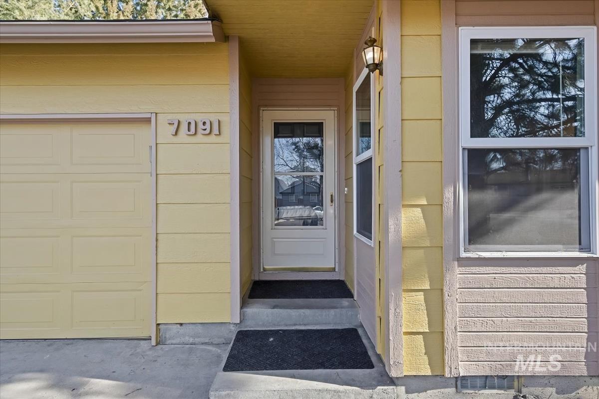 7091 West Limelight Street Boise, ID 83714 - Photo 3 of 34 Doorway to property featuring a garage
