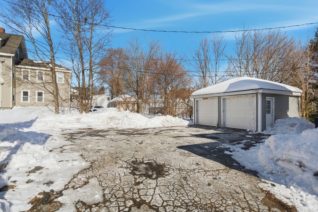 20 Wilson Street, Unit 2 Natick, MA 01760 - Photo 11 of 11 a view of a yard with a house covered in snow