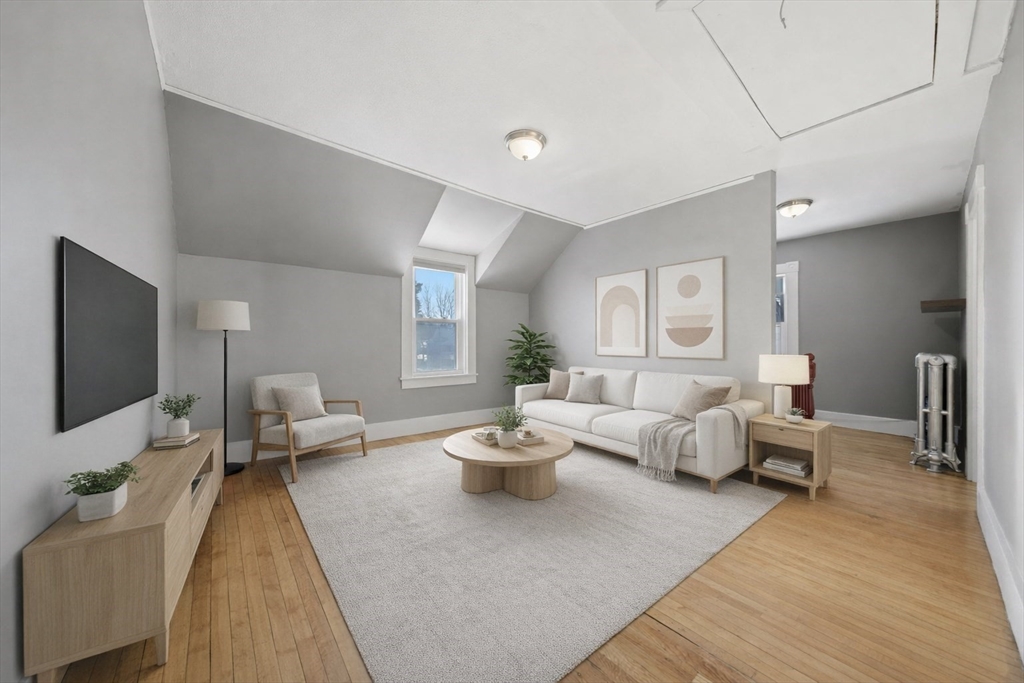 20 Wilson Street, Unit 2 Natick, MA 01760 - Photo 3 of 11 a living room with furniture and a flat screen tv