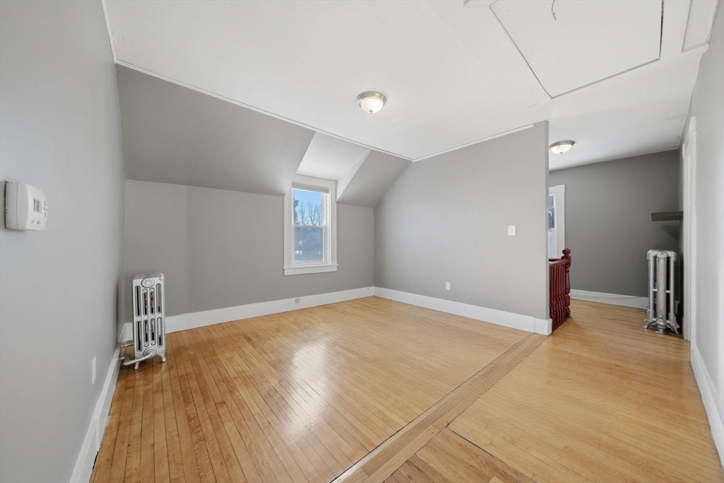 20 Wilson Street, Unit 2 Natick, MA 01760 - Photo 4 of 11 a view of empty room with wooden floor