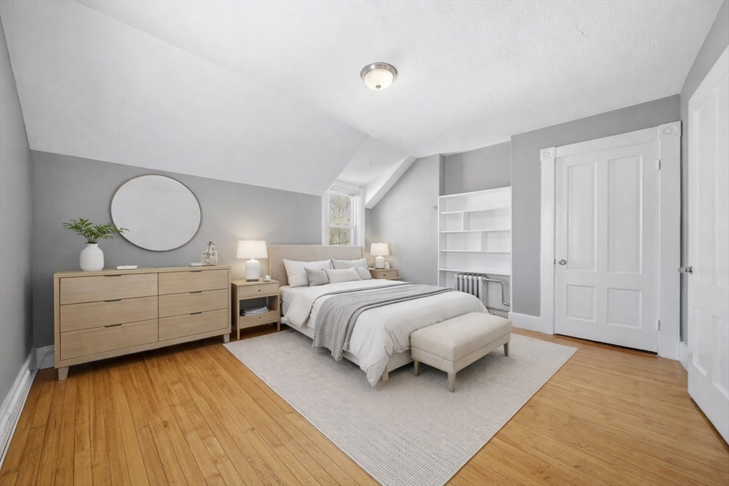 20 Wilson Street, Unit 2 Natick, MA 01760 - Photo 5 of 11 a bedroom with a bed and window