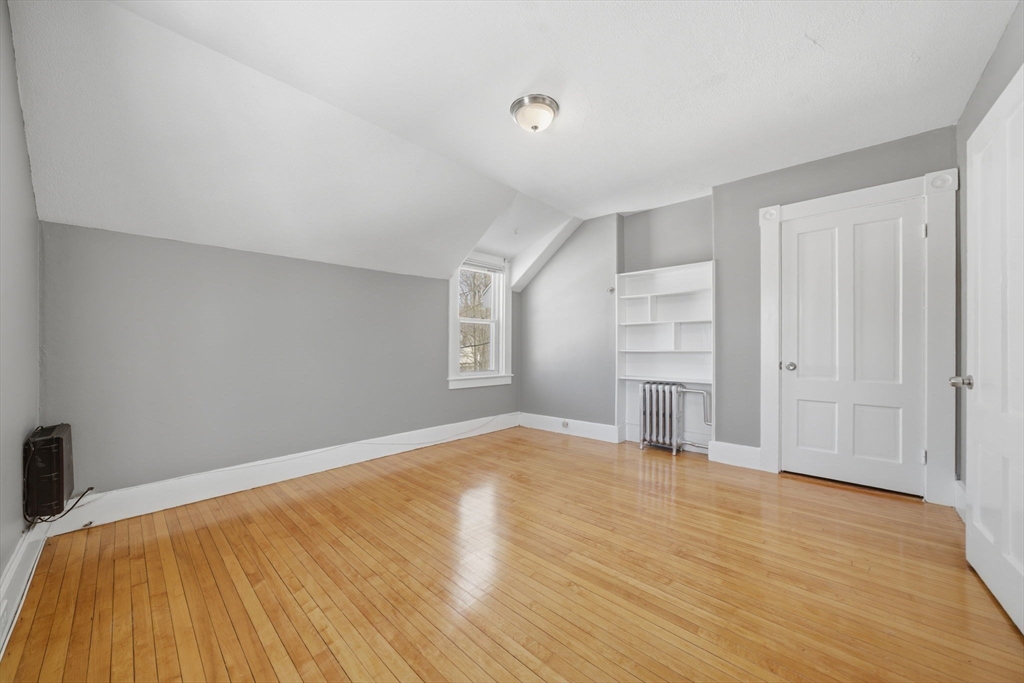 20 Wilson Street, Unit 2 Natick, MA 01760 - Photo 6 of 11 a view of empty room with wooden floor and fan