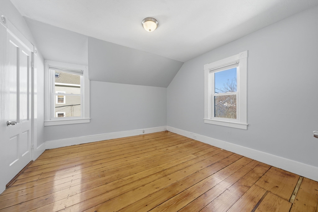 20 Wilson Street, Unit 2 Natick, MA 01760 - Photo 8 of 11 a view of empty room with wooden floor and fan