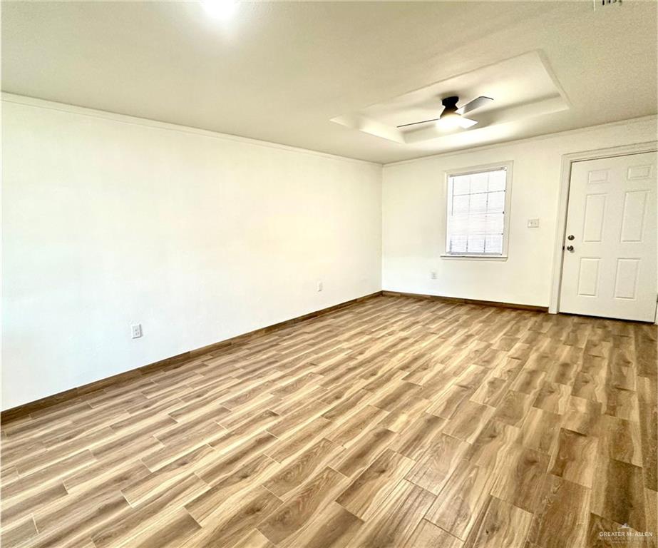 2714 West Mile 17 1/2 Road, Unit 23 Edinburg, TX 78541 - Photo 2 of 14 a view of empty room with wooden floor