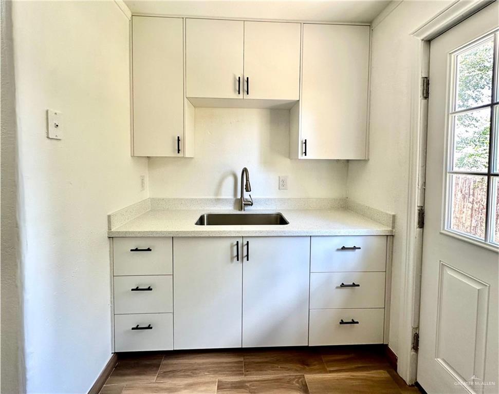 2714 West Mile 17 1/2 Road, Unit 23 Edinburg, TX 78541 - Photo 5 of 14 a kitchen with cabinets appliances and a window