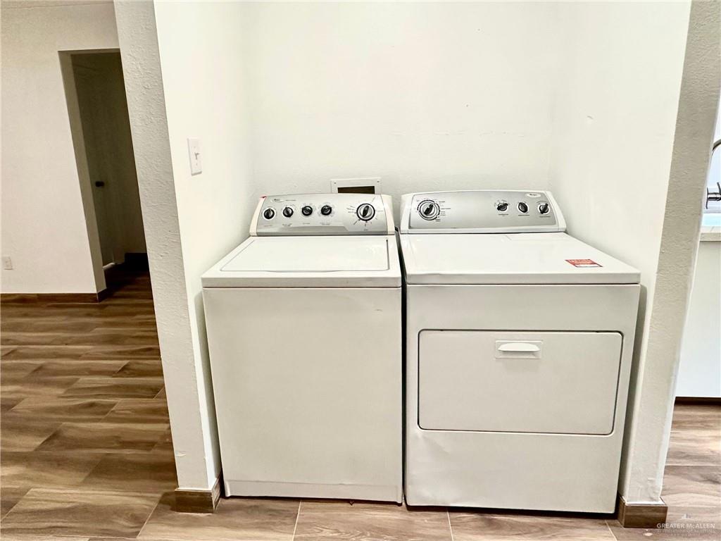 2714 West Mile 17 1/2 Road, Unit 23 Edinburg, TX 78541 - Photo 6 of 14 a utility room with dryer and washer