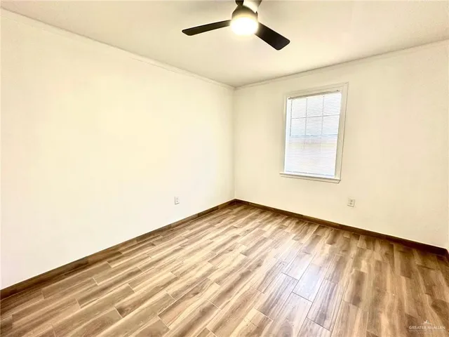 a view of an empty room and a window