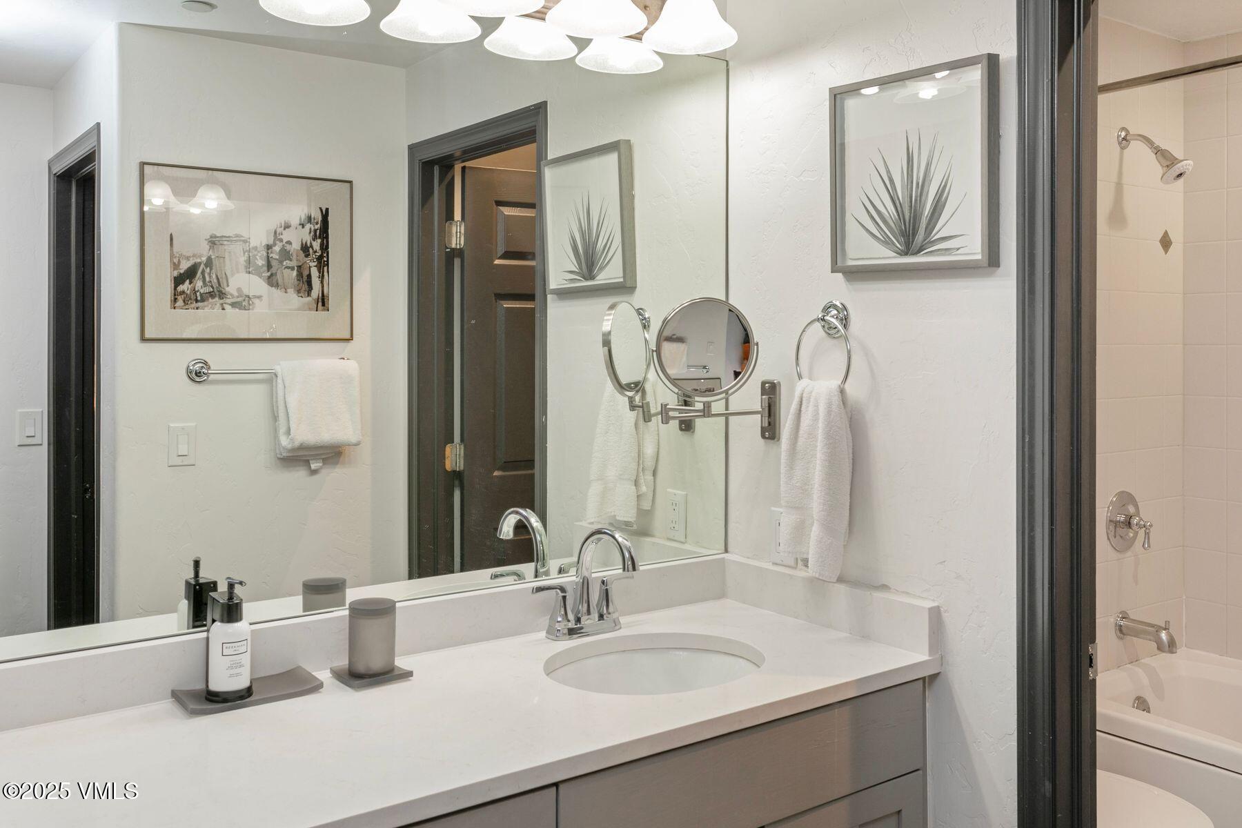 97 Main Street, Unit 304 Edwards, CO 81632 - Photo 15 of 31 a bathroom with a sink and a mirror
