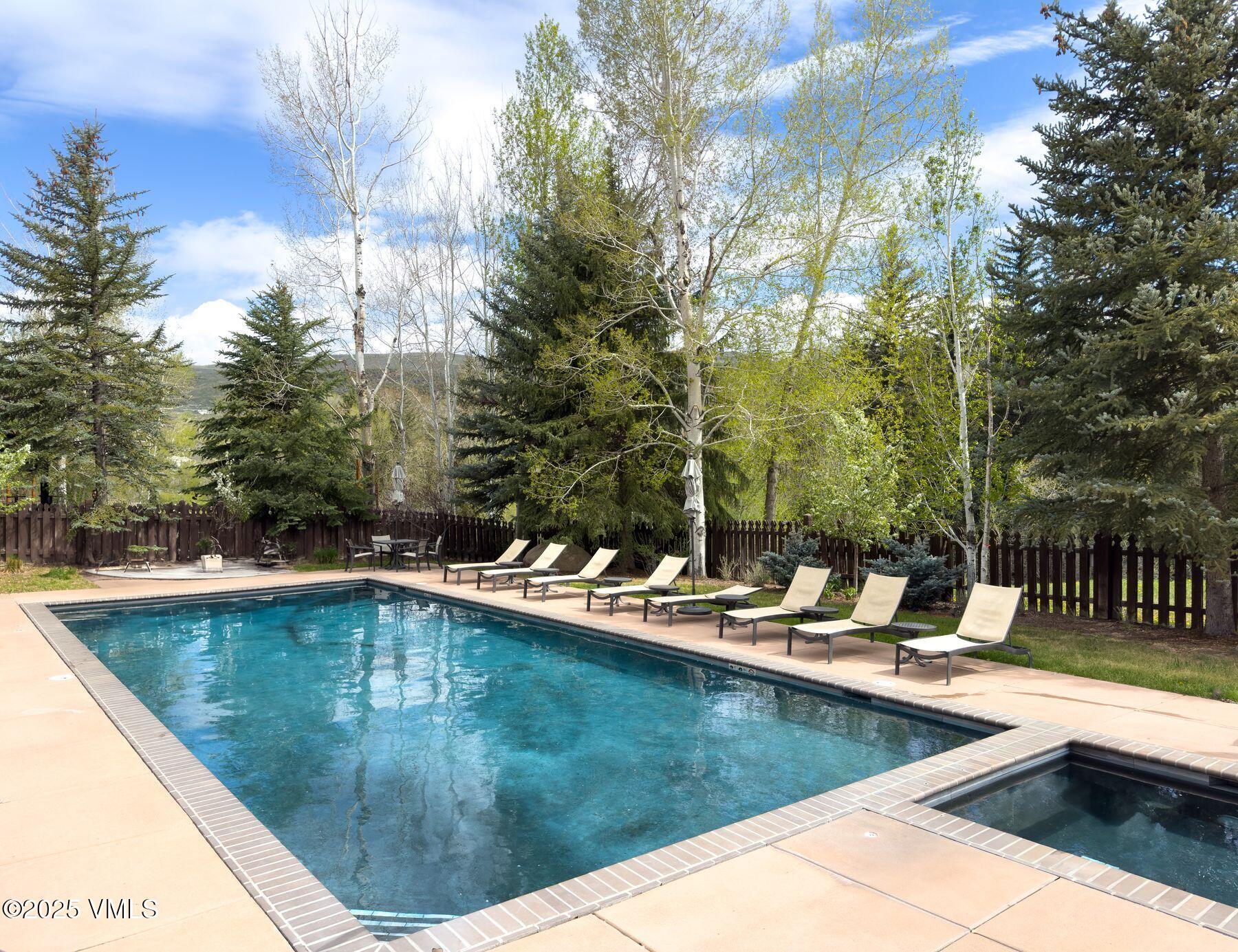 97 Main Street, Unit 304 Edwards, CO 81632 - Photo 21 of 31 a view of a swimming pool with chairs