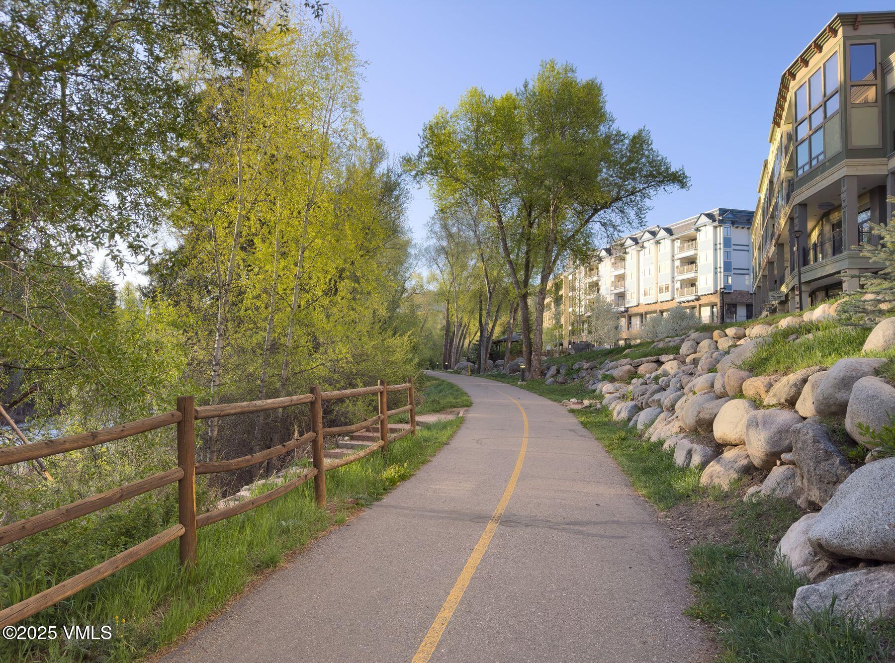 97 Main Street, Unit 304 Edwards, CO 81632 - Photo 30 of 31 a view of a pathway with a wrought fence