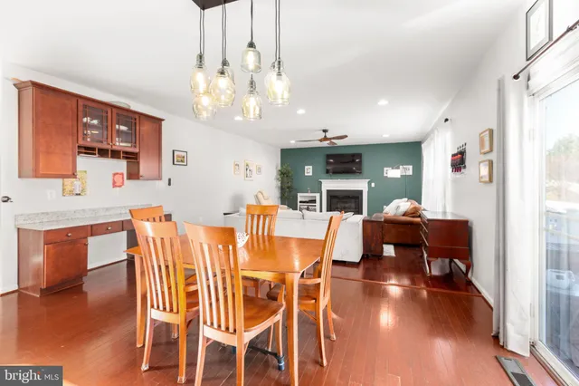 a living room with fireplace furniture and a flat screen tv