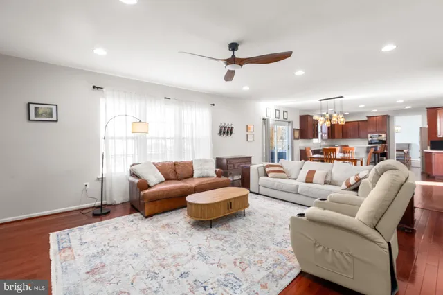 a spacious bedroom with a bed and a large window
