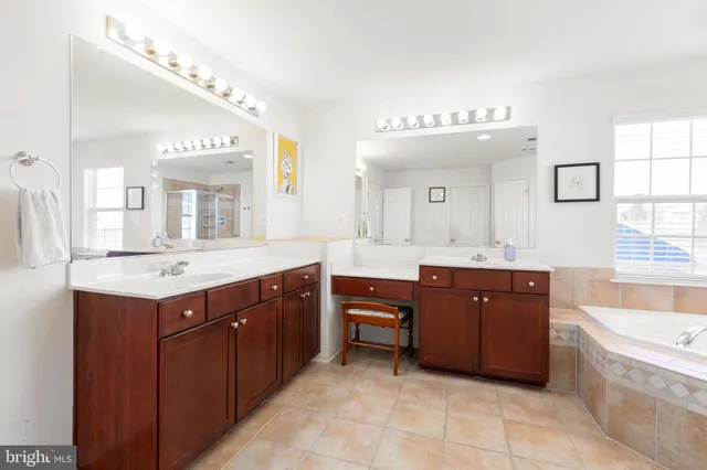 a living room with furniture gym equipment and a large window