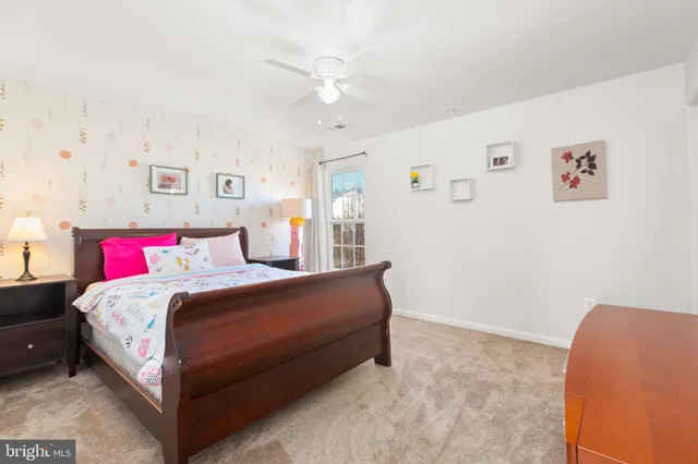 a bathroom with a sink a toilet and shower curtain