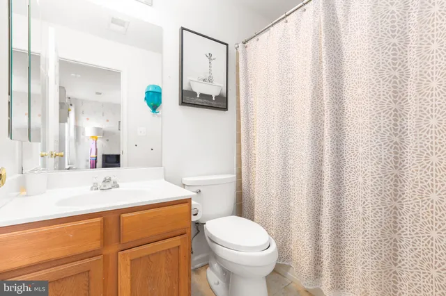 a bedroom with bed and a chandelier