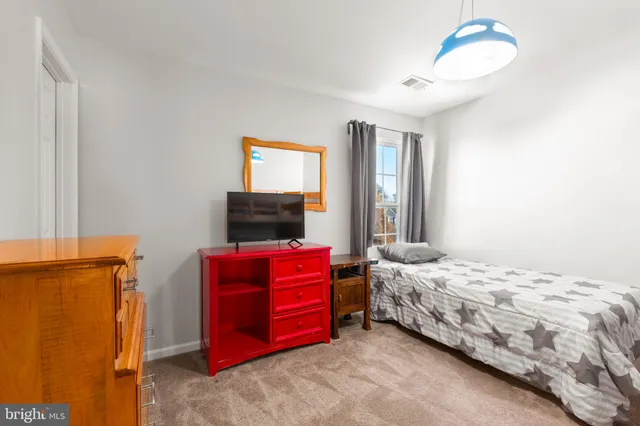 a room with furniture and a flat screen tv