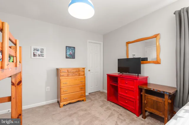 a bed room with a bed and a window