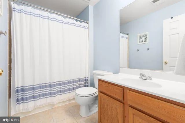 a bedroom with a bed and a cabinets