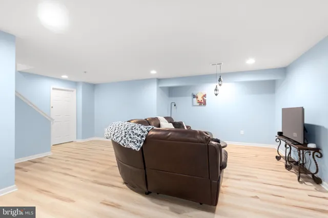 a view of a workspace with furniture and a potted plant