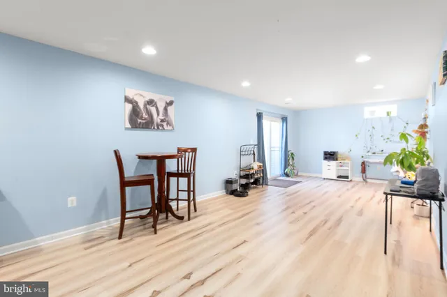 a view of kitchen with furniture and wooden floor