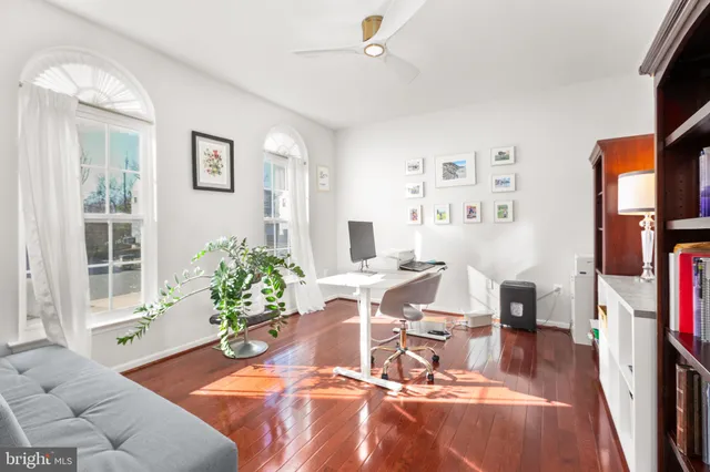 a workspace with furniture and a book shelf
