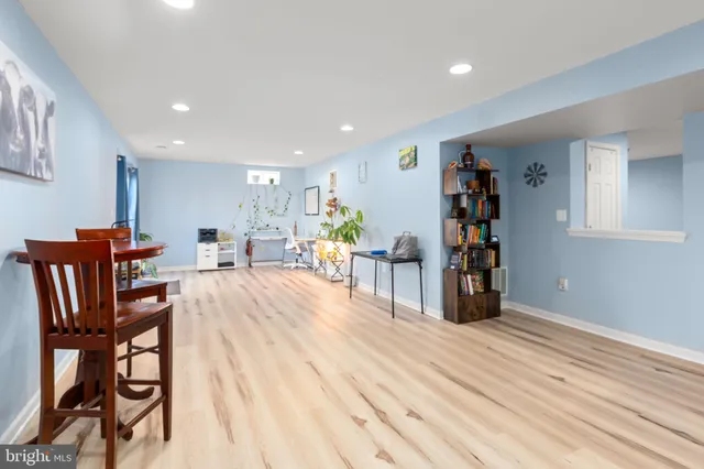 a bedroom with a bed and a television