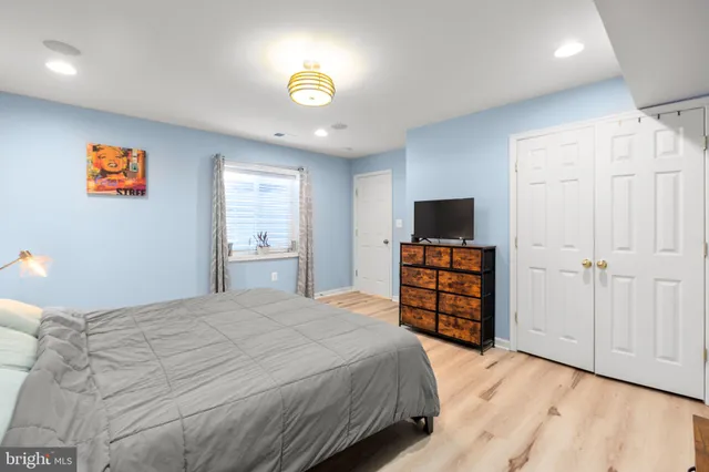 a backyard of a house with wooden floor chairs sofa and barbecue oven